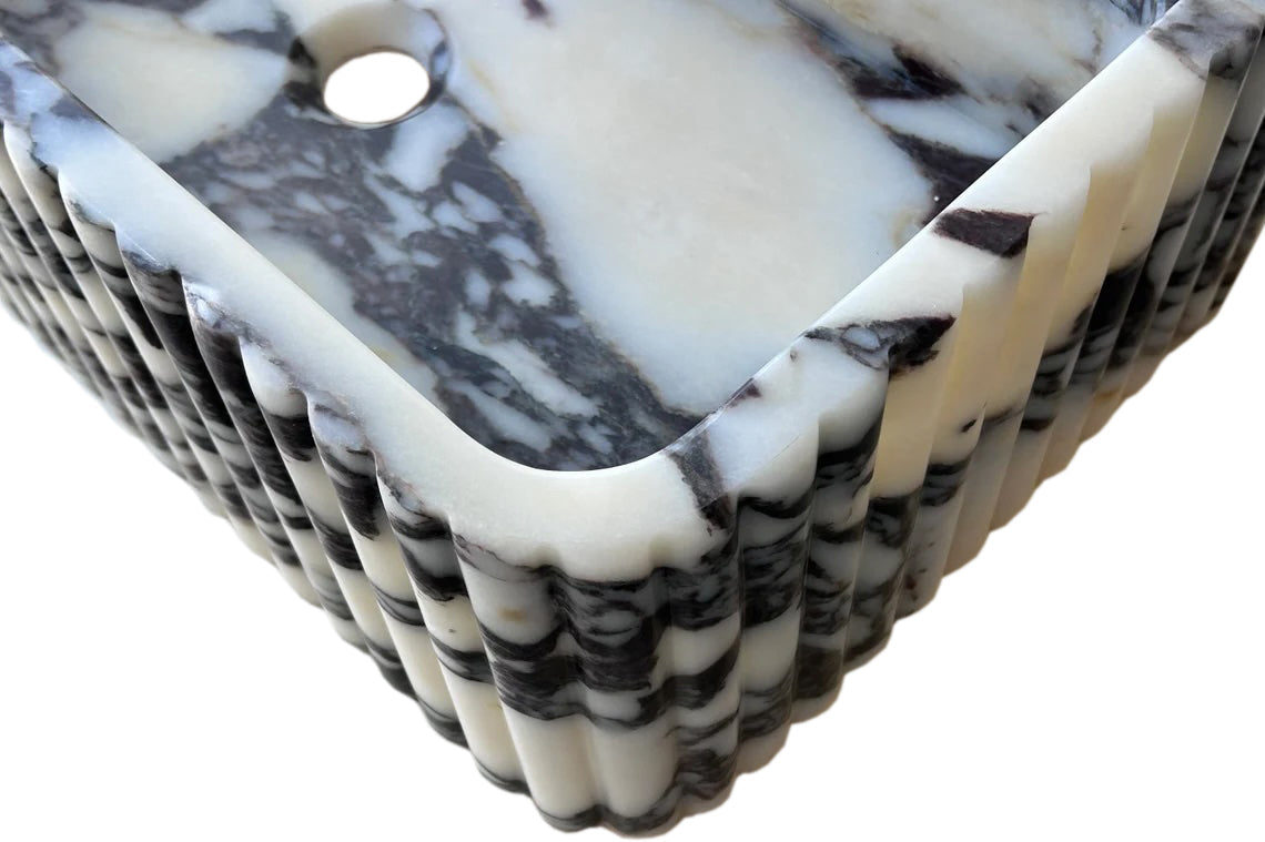 Calacatta Viola wall-mount sink featuring elegant marble design for modern bathrooms