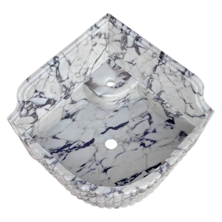 Elegant Calacatta Viola marble corner sink ideal for modern bathroom designs with luxurious stone finish.