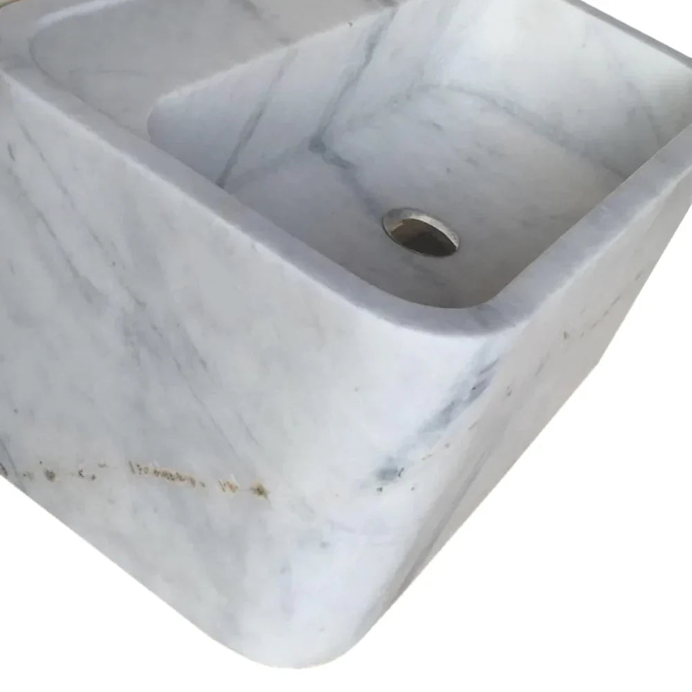 Elegant Carrara marble wall-mount sink showcasing timeless design and superior craftsmanship for modern bathroom interiors