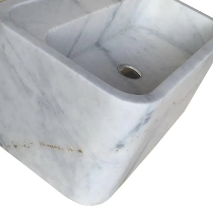 Elegant Carrara marble wall-mount sink showcasing timeless design and superior craftsmanship for modern bathroom interiors