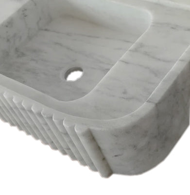 Elegant Carrara Marble vanity sink showcasing timeless luxury and sophisticated bathroom design.