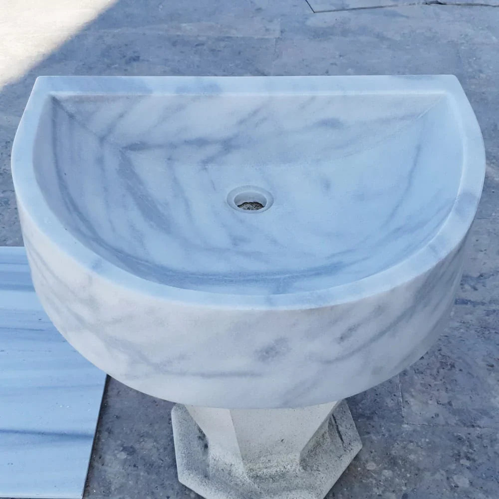 Elegant Carrara White wall-mount sink showcasing modern bathroom design and space-saving functionality