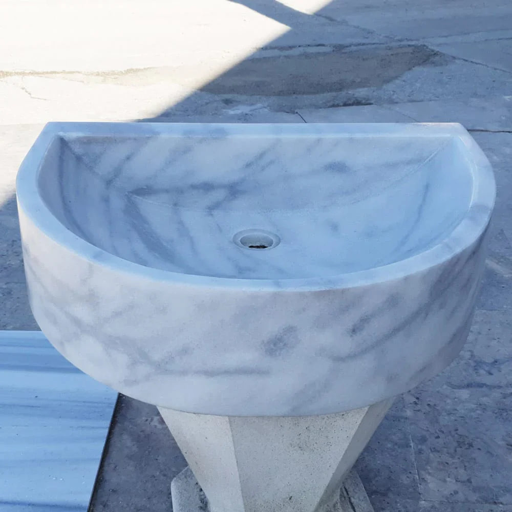 Elegant Carrara White wall-mount sink showcasing modern bathroom design and space-saving functionality