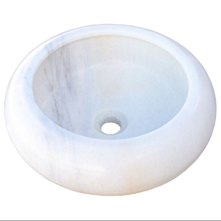 Carrara white marble vessel sink with polished finish, showcasing minimalist design and unique craftsmanship.