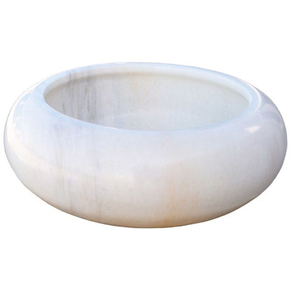 Carrara white marble vessel sink with polished finish, showcasing minimalist design and unique craftsmanship.