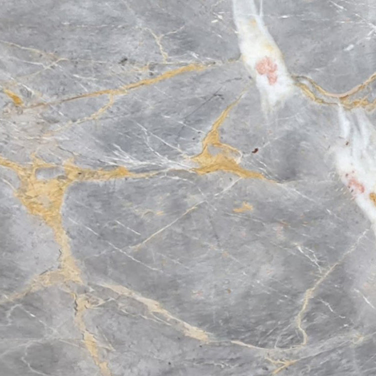 Gris Dorado marble slabs showcasing elegant texture and premium quality for sophisticated interior designs.