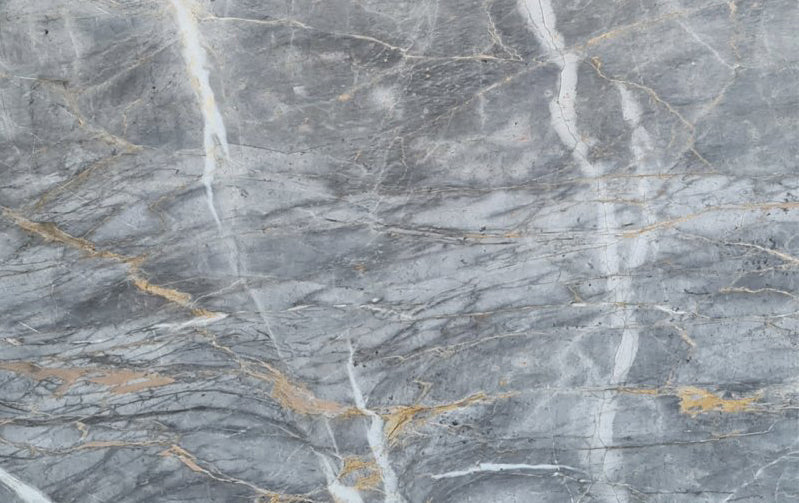 Gris Dorado marble slabs showcasing elegant texture and premium quality for sophisticated interior designs.
