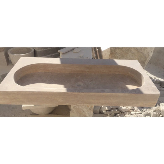 Elegant travertine bathroom sink showcasing natural stone textures for a luxurious and durable bathroom design.