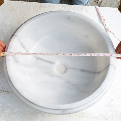 Elegant Carrara marble vanity sink showcasing timeless design and durable craftsmanship for luxury bathrooms.