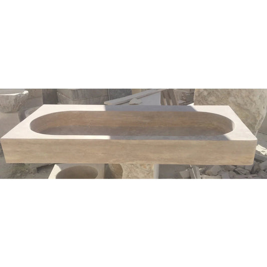 Elegant travertine bathroom sink showcasing natural stone textures for a luxurious and durable bathroom design.