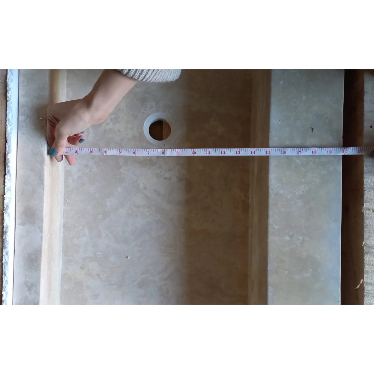 Elegant travertine bathroom sink showcasing natural stone textures for a luxurious and durable bathroom design.