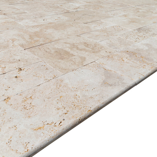 Elegant travertine pool tiles enhancing outdoor swimming area with durable and stylish natural stone