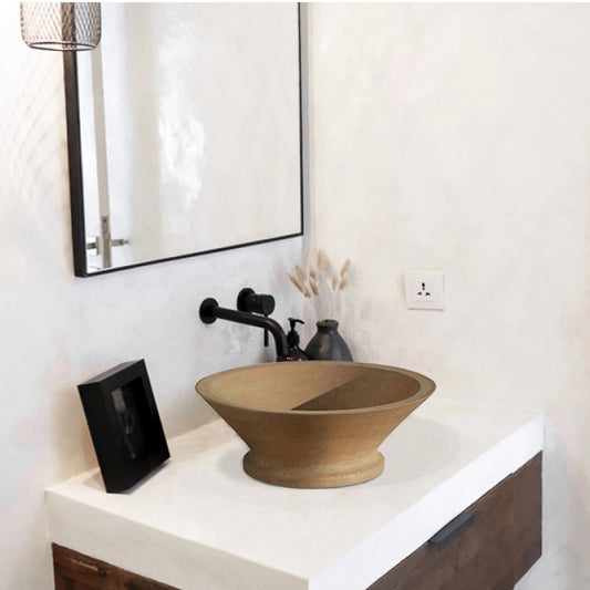 Elegant travertine vessel sink enhancing modern bathroom aesthetics with natural stone charm.
