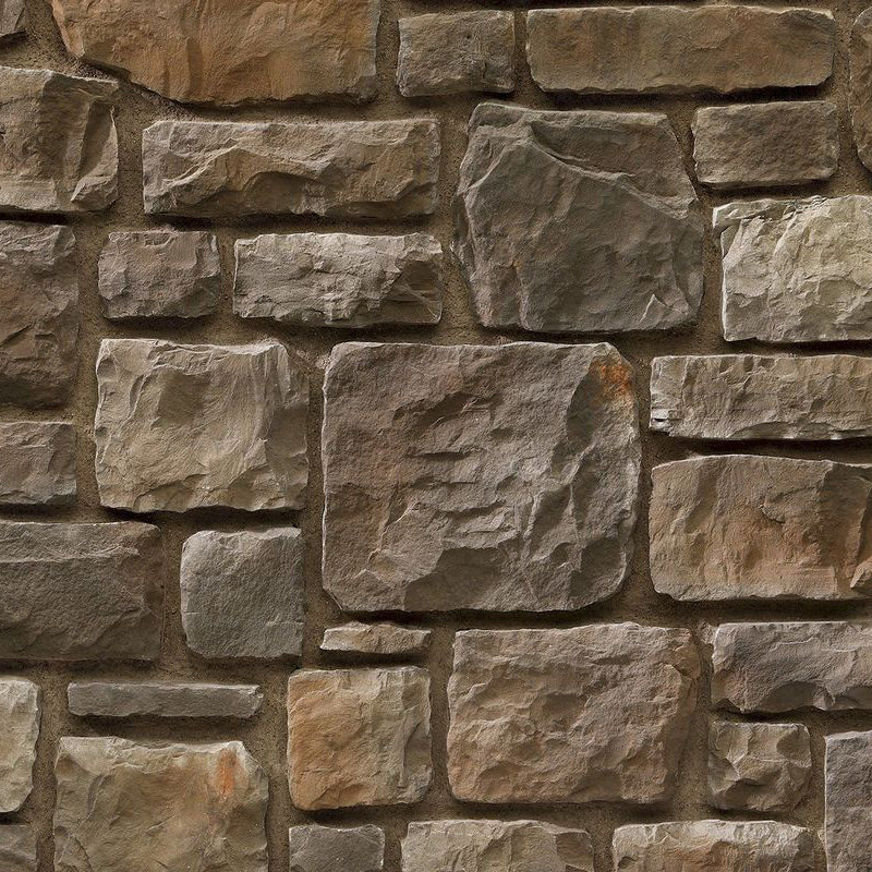 Elegant ashlar stone wall showcasing refined craftsmanship and timeless architectural design.