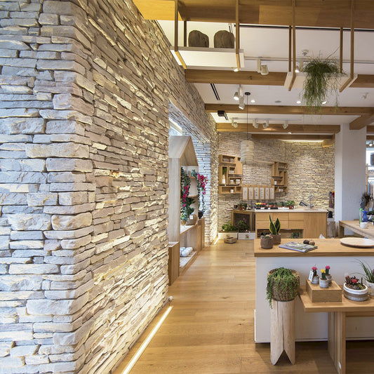 Sierra Pearl manufactured stone exterior wall showcasing natural texture and durability