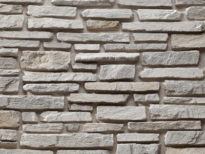 Sierra Pearl manufactured stone exterior wall showcasing natural texture and durability