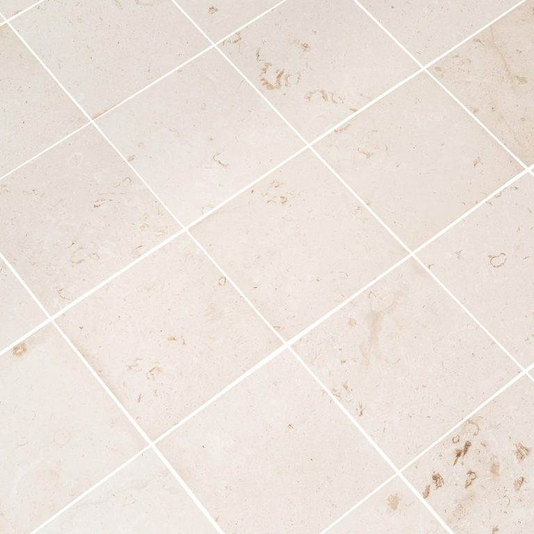 Close-up of durable white limestone surface showcasing natural texture and strength for construction use