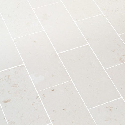 Close-up of durable white limestone surface showcasing natural texture and strength for construction use