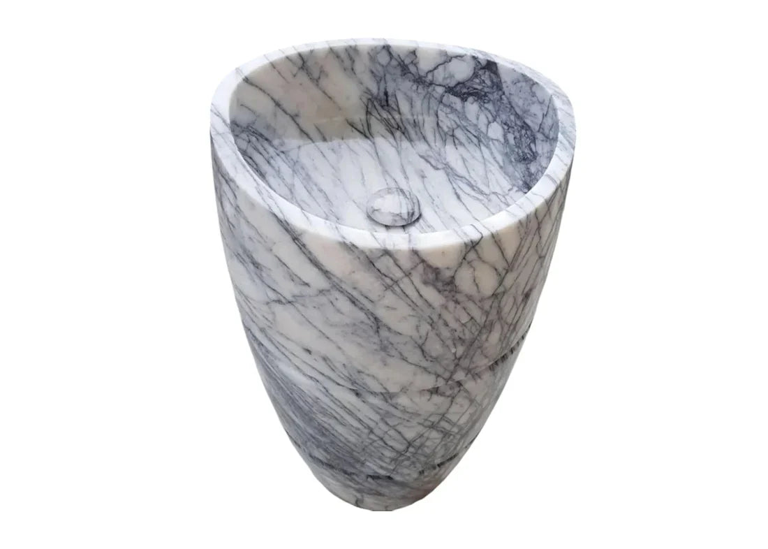 Elegant marble pedestal sink showcasing timeless design and superior craftsmanship for luxurious bathroom aesthetics