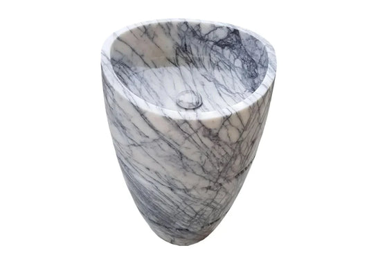 Elegant marble pedestal sink showcasing timeless design and superior craftsmanship for luxurious bathroom aesthetics