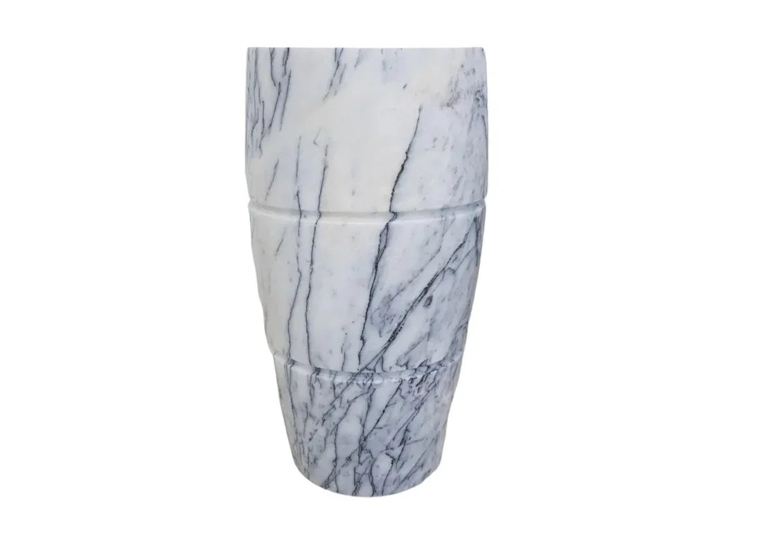 Elegant marble pedestal sink showcasing timeless design and superior craftsmanship for luxurious bathroom aesthetics