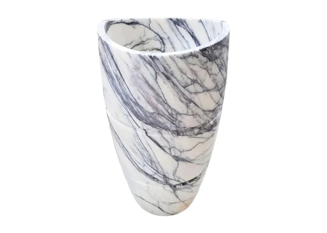 Elegant marble pedestal sink showcasing timeless design and superior craftsmanship for luxurious bathroom aesthetics
