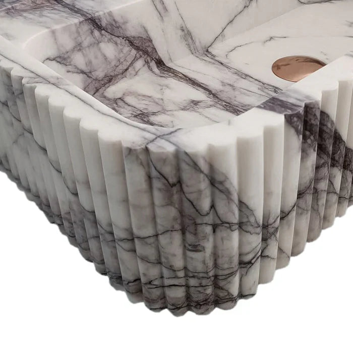 Elegant marble sink showcasing smooth texture and refined craftsmanship, perfect for modern bathroom design