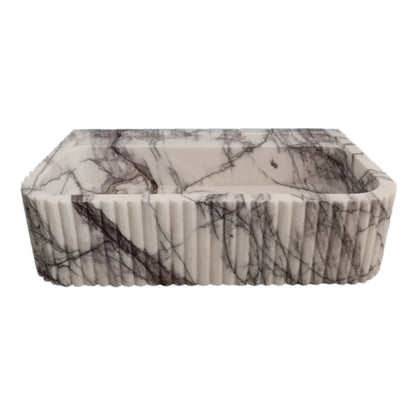 Elegant marble sink showcasing smooth texture and refined craftsmanship, perfect for modern bathroom design