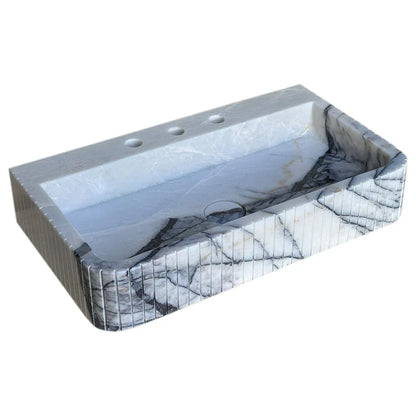 Elegant marble sink showcasing refined craftsmanship and luxurious bathroom design