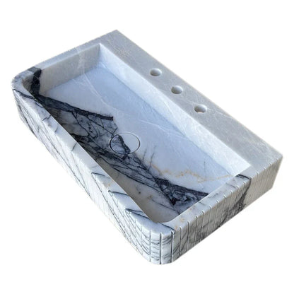 Elegant marble sink showcasing refined craftsmanship and luxurious bathroom design