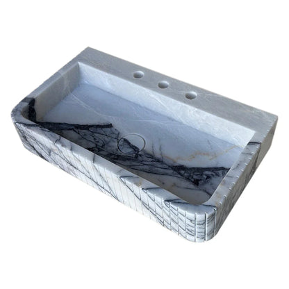 Elegant marble sink showcasing refined craftsmanship and luxurious bathroom design