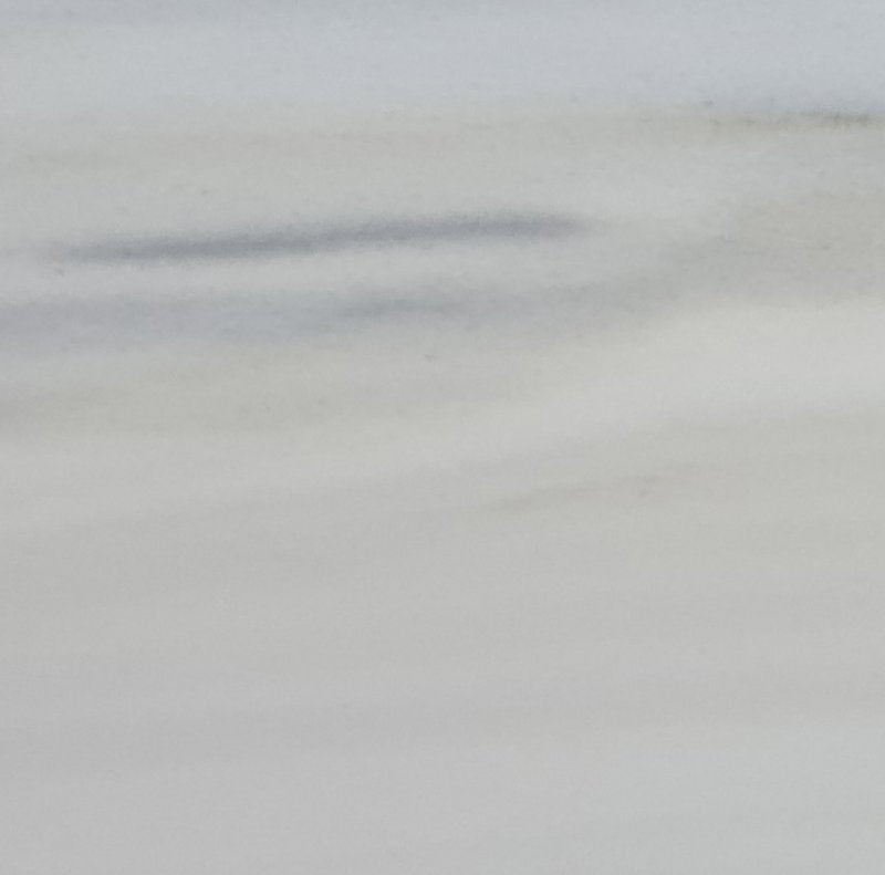 Panda Classico white marble slab showcasing elegant natural patterns ideal for luxury interior design applications.