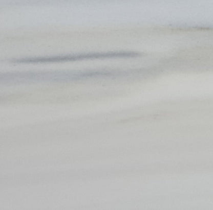 Panda Classico white marble slab showcasing elegant natural patterns ideal for luxury interior design applications.