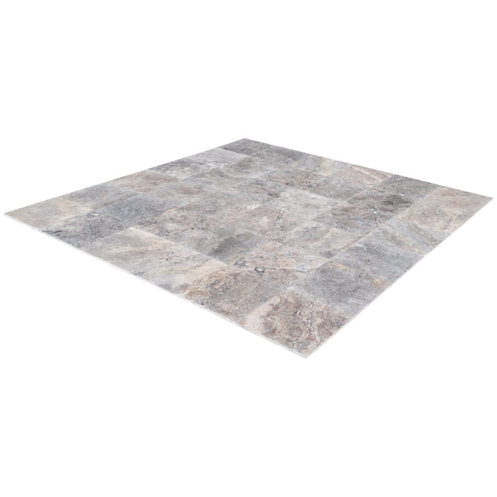 Elegant pewter vase displayed on a polished travertine surface, illustrating a blend of classic and modern decor.