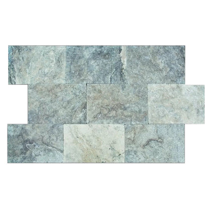 Elegant silver decor complimenting natural travertine stone for sophisticated interior design.