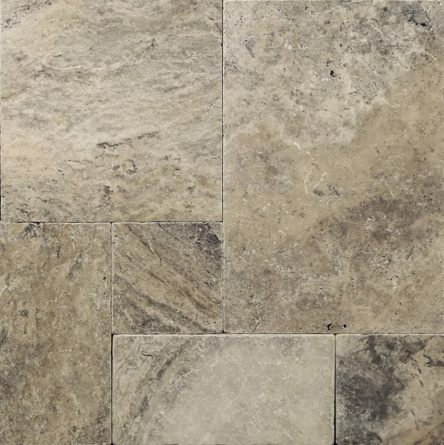 Elegant silver decor complimenting natural travertine stone for sophisticated interior design.