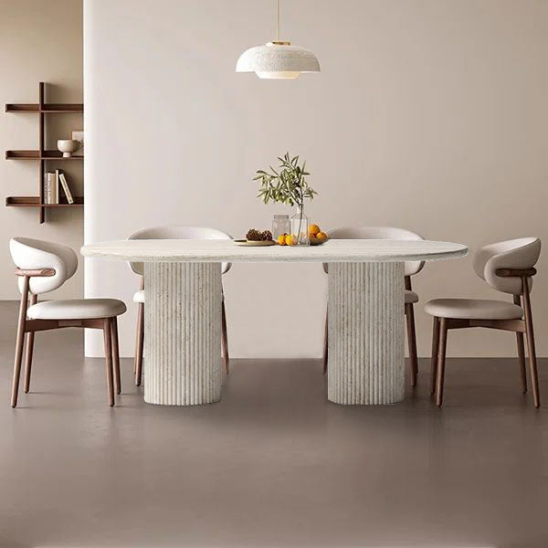Elegant travertine dining table showcasing natural stone texture and sophisticated design for upscale interiors.