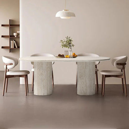 Elegant travertine dining table showcasing natural stone texture and sophisticated design for upscale interiors.