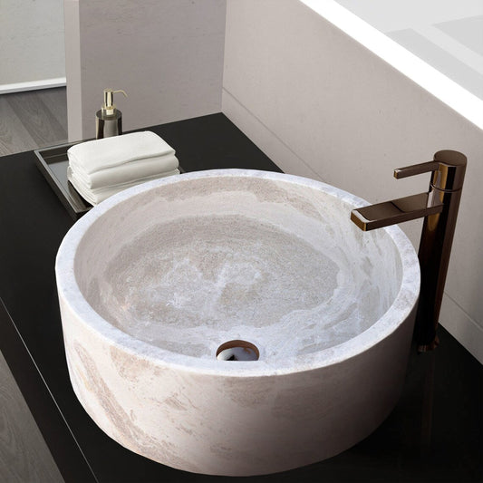 Elegant limestone vessel sink showcasing natural stone texture, perfect for modern bathroom designs