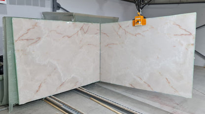White Onyx bookmatching slabs showcasing luxurious natural stone patterns for elegant interior design